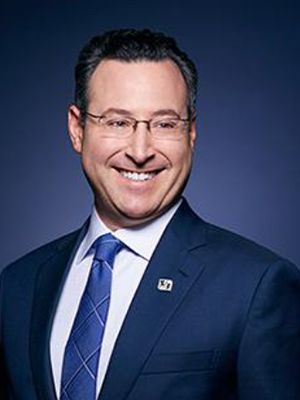 A headshot photo of Joshua Landau, SVP, Group Head Financial Institutions Group