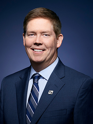 A headshot photo of Pete Foley, SVP, Group Head Technology, Media and Telecommunications