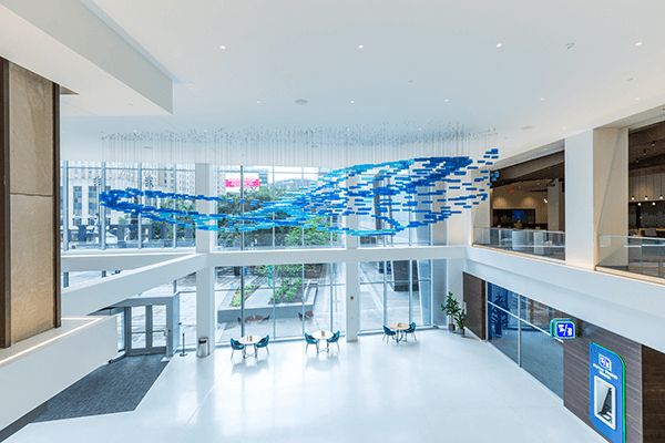 Fifth Third Center atrium lobby with art sculpture welcoming employees and customers to downtown branch and office space. 