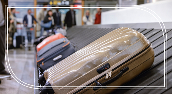 People waiting at the airport for luggage