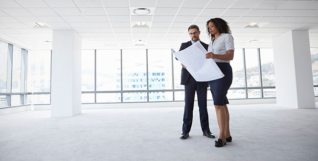 Two business people meeting in available space