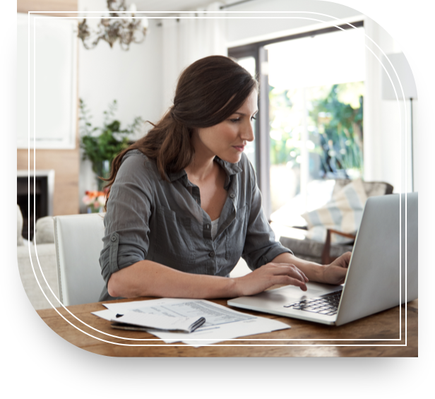 Woman on her laptop checking looking up private banking services.