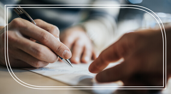 Two people updating a document for a cash management account.