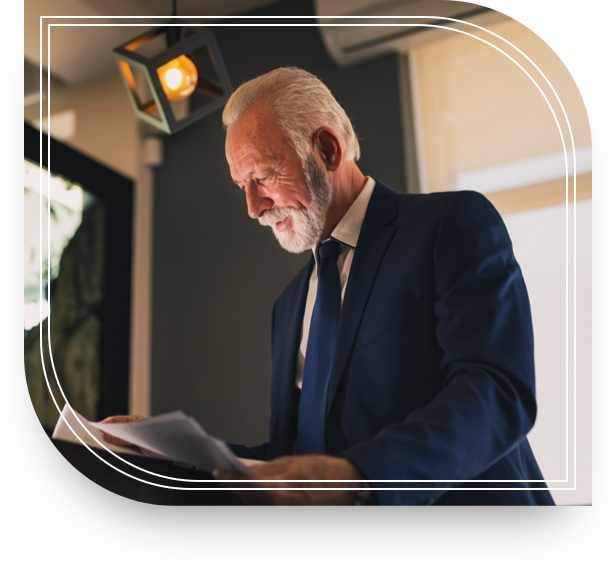 Man looking over documents of his Private Bank savings account.