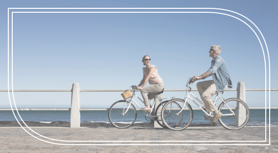 A couple riding bikes after making their wills and getting their estate plans in order with Fifth Third Bank.