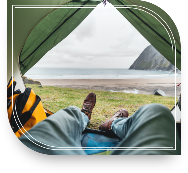 Man relaxing in a tent on a beach after settling on his tax strategies. 